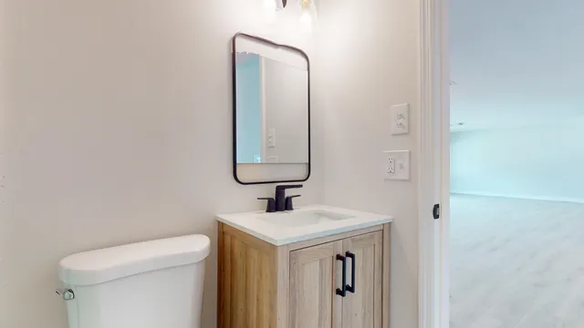 a bathroom with a toilet and a sink