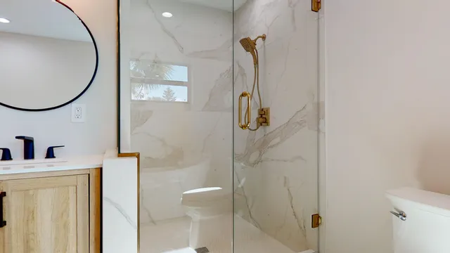 a view of a bathroom with wooden floor and a window