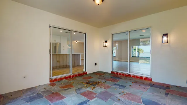 an aerial view of residential house with outdoor space and swimming pool