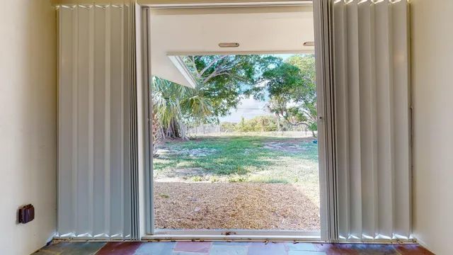 a backyard of a house with lots of green space