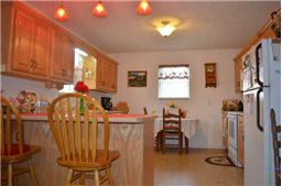 And what a kitchen!! Plenty of cabinets and counter space. What a set up for entertaining.