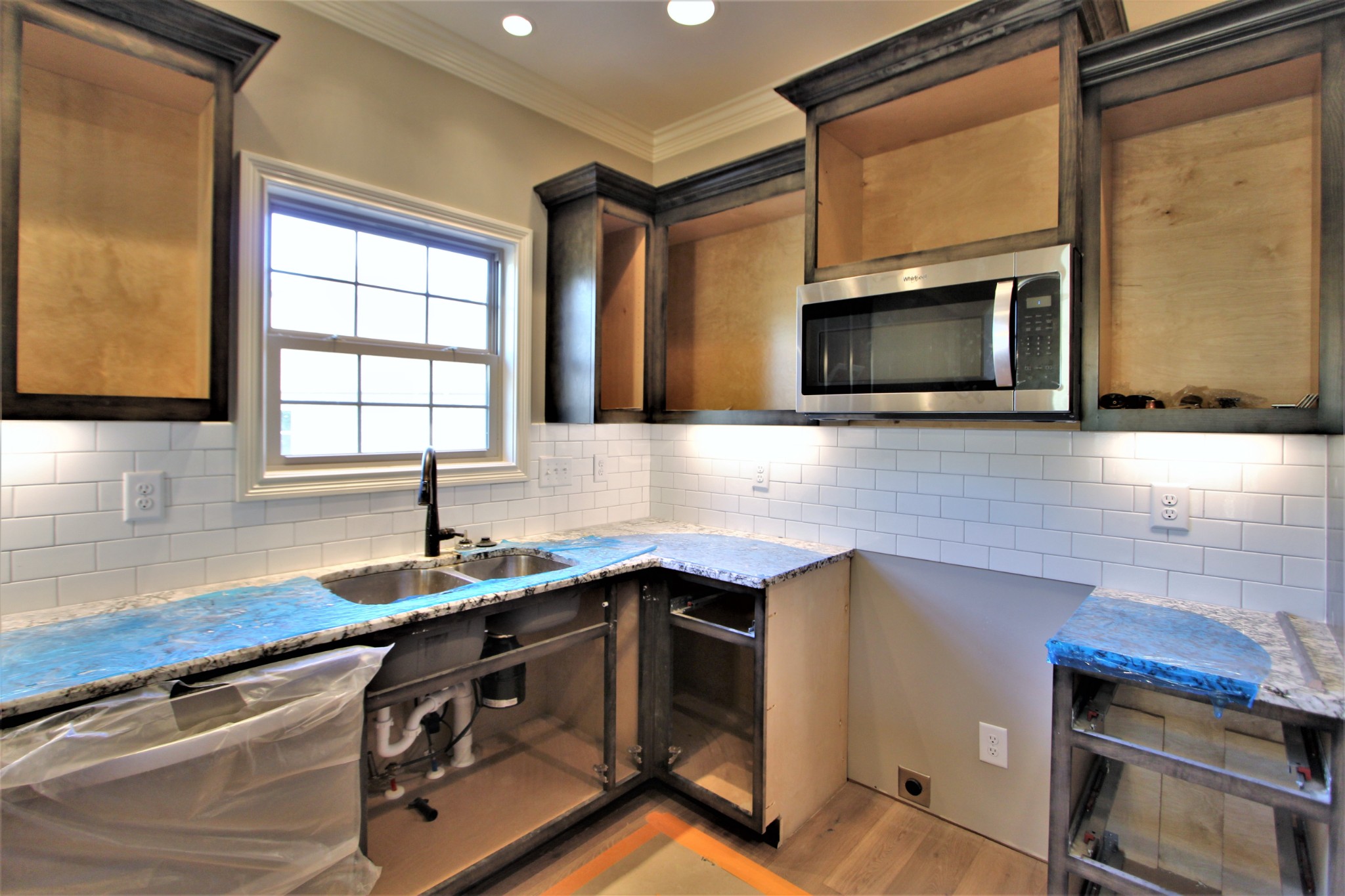 253 Ridgewater Way, Unit 85 Mount Juliet, TN 37122 - Photo 11 of 23 a kitchen with a sink stove and microwave
