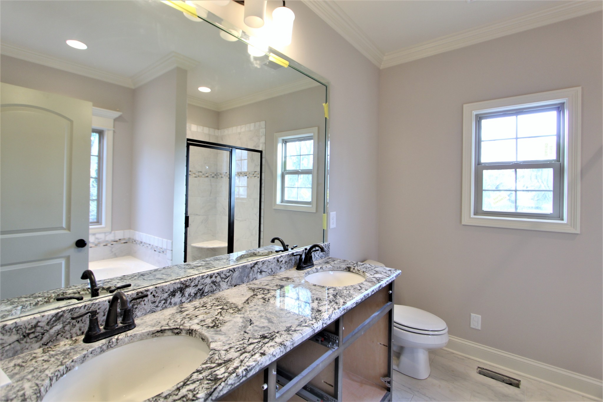 253 Ridgewater Way, Unit 85 Mount Juliet, TN 37122 - Photo 14 of 23 a bathroom with a granite countertop sink and a mirror