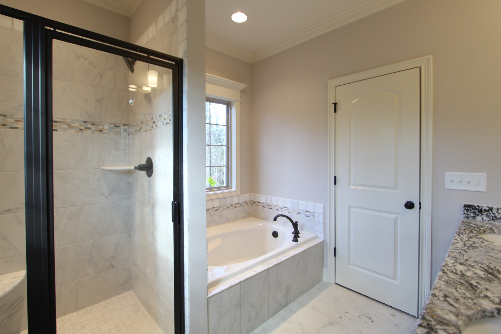 253 Ridgewater Way, Unit 85 Mount Juliet, TN 37122 - Photo 15 of 23 a bathroom with a bathtub and shower