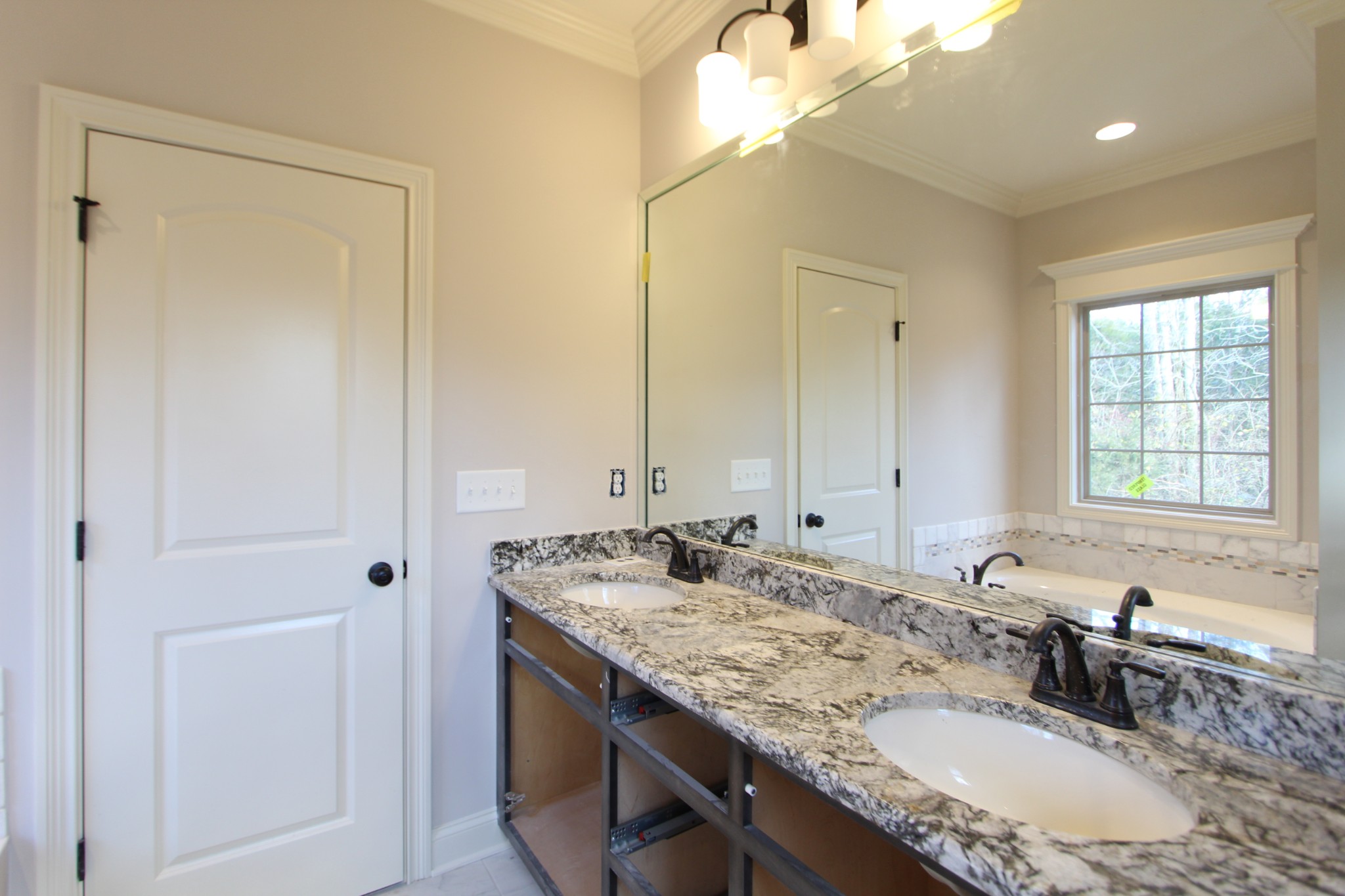 253 Ridgewater Way, Unit 85 Mount Juliet, TN 37122 - Photo 16 of 23 a bathroom with a granite countertop sink and a mirror