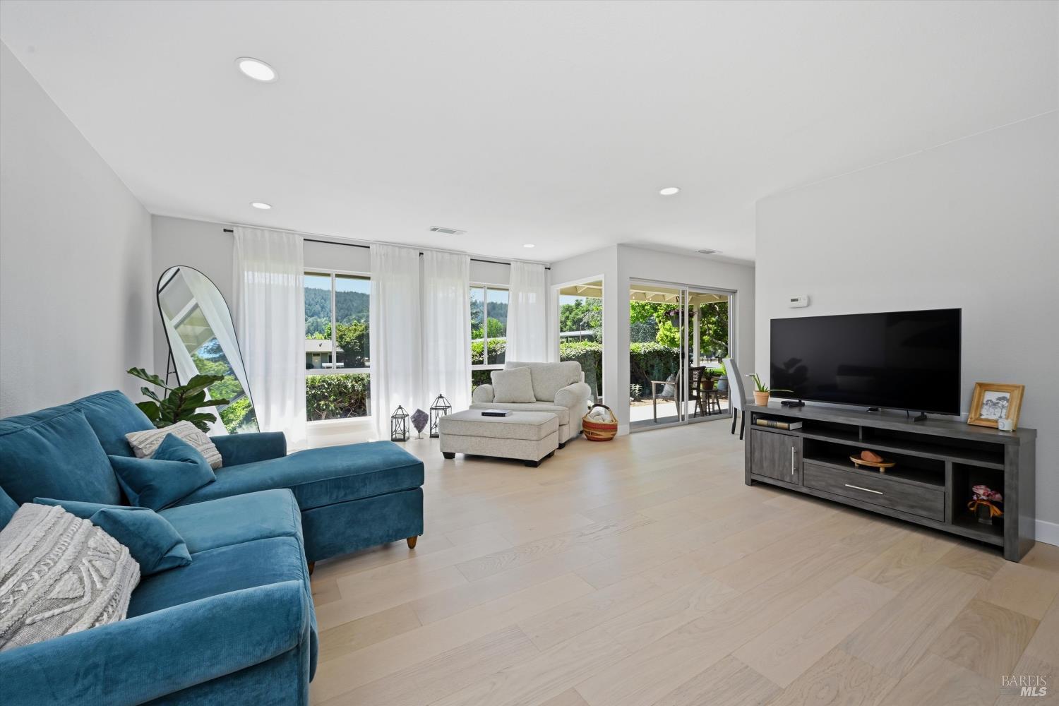 23 Valley Green Street Santa Rosa, CA 95409 - Photo 2 of 58 a living room with furniture and a flat screen tv