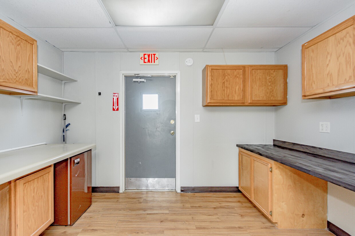 3373 East Highway 6 Alvin, TX 77511 - Photo 11 of 28 a view of a kitchen with fridge and wooden floor