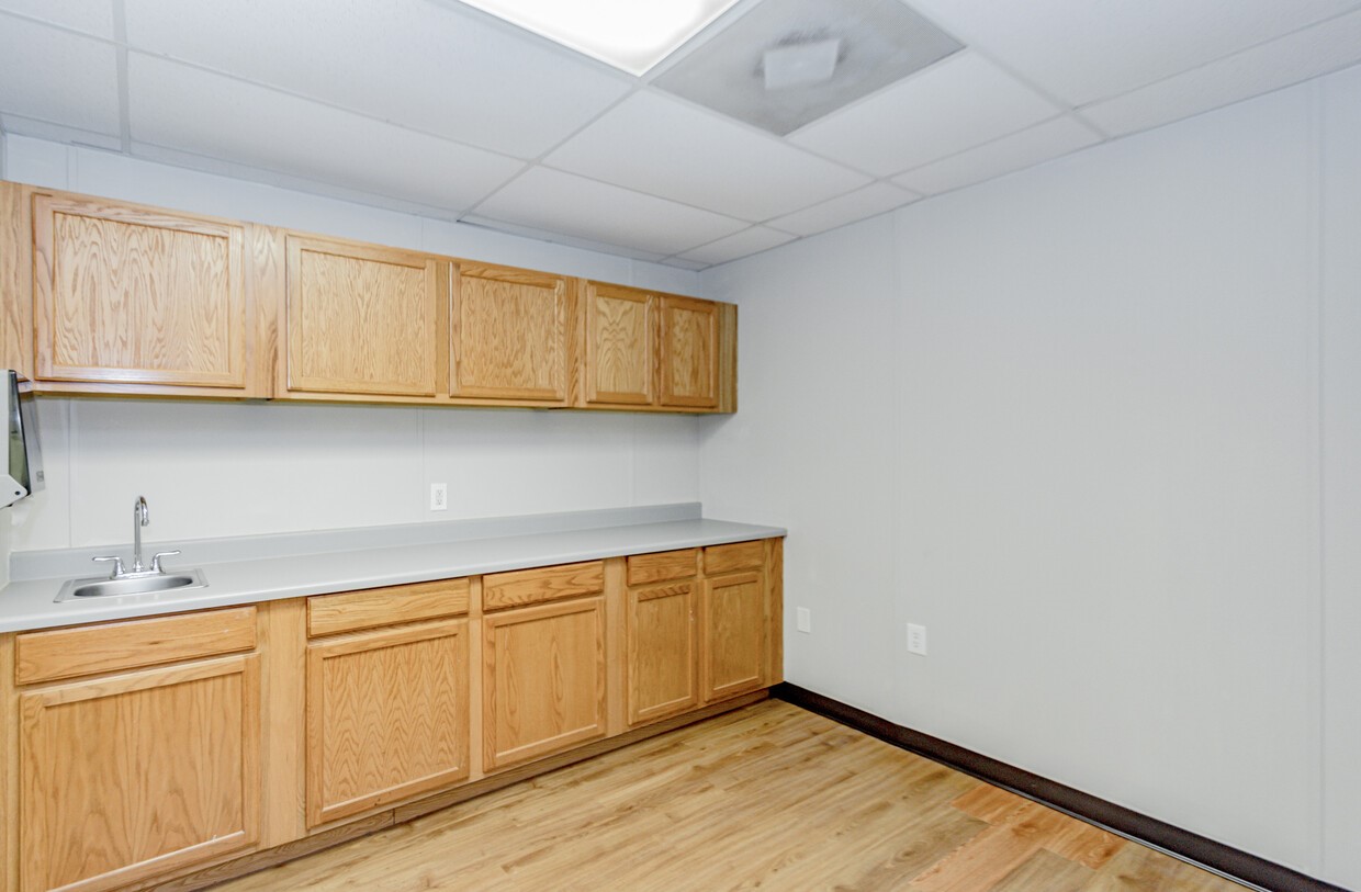 3373 East Highway 6 Alvin, TX 77511 - Photo 14 of 28 a view of cabinets with wooden cabinets