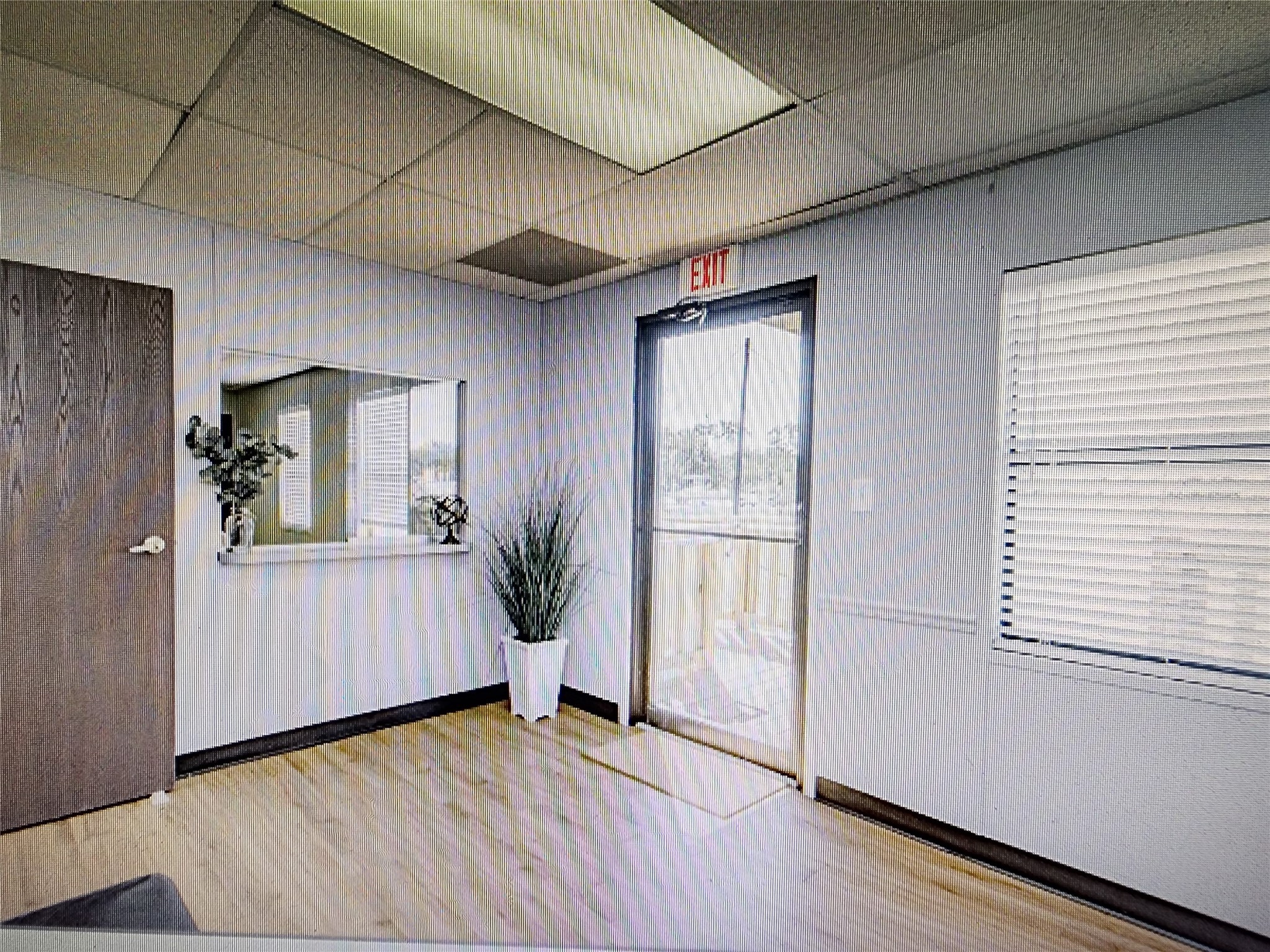 3373 East Highway 6 Alvin, TX 77511 - Photo 23 of 28 an empty room with wooden floor and windows