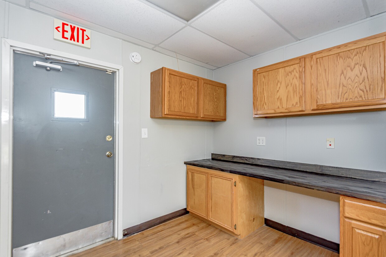 3373 East Highway 6 Alvin, TX 77511 - Photo 6 of 28 a kitchen with stainless steel appliances granite countertop cabinets and wooden floor