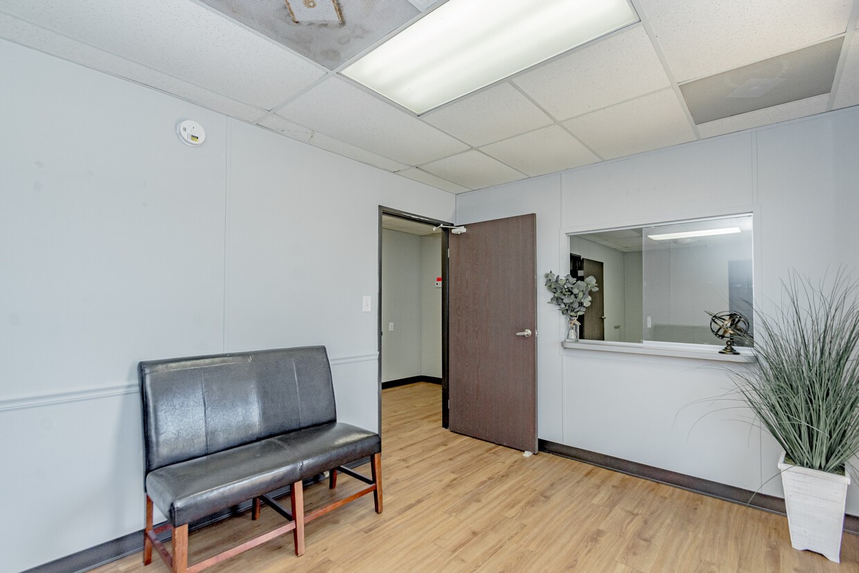 3373 East Highway 6 Alvin, TX 77511 - Photo 7 of 28 a living room with furniture and a potted plant