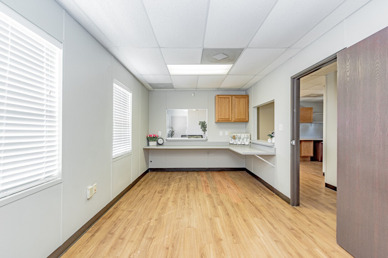 3373 East Highway 6 Alvin, TX 77511 - Photo 8 of 28 a view of a kitchen with kitchen island a sink stainless steel appliances counter space and a window