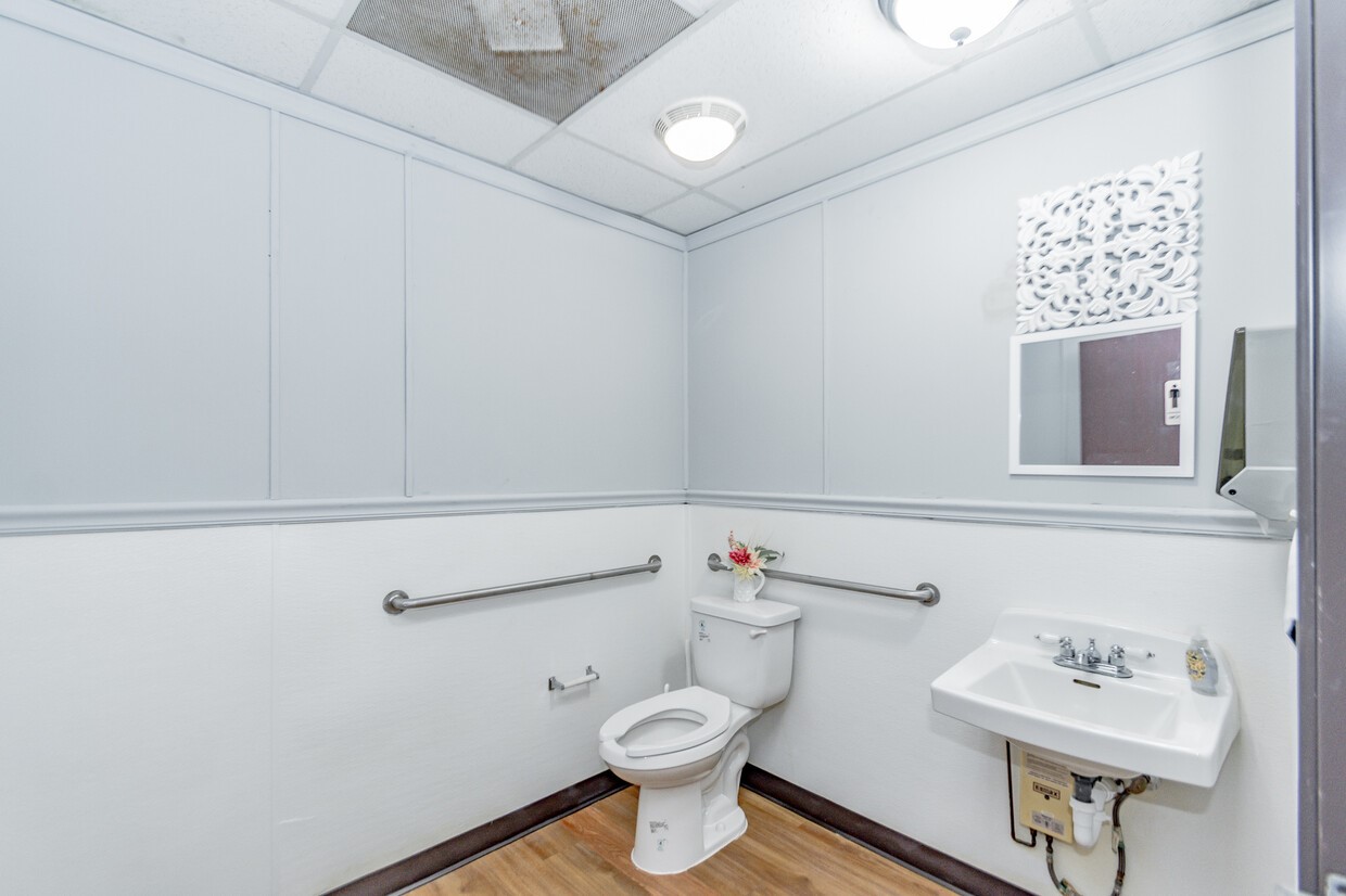 3373 East Highway 6 Alvin, TX 77511 - Photo 10 of 28 a bathroom with a toilet and a sink
