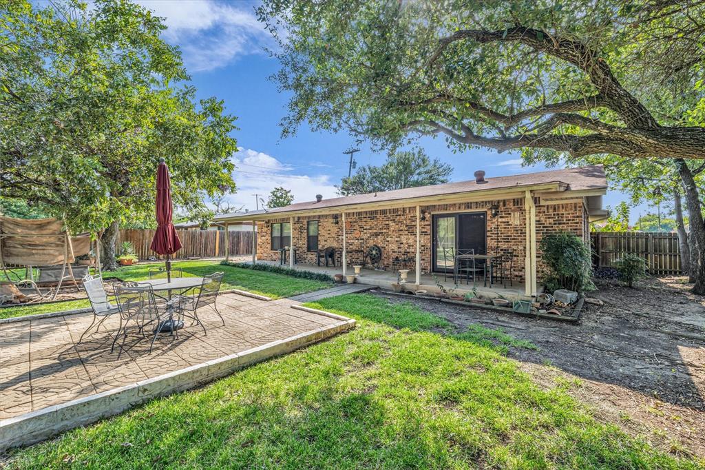 3405 Edna Avenue Waco, TX 76708 - Photo 22 of 29 Back of house featuring a patio area, a fenced backyard, and brick siding