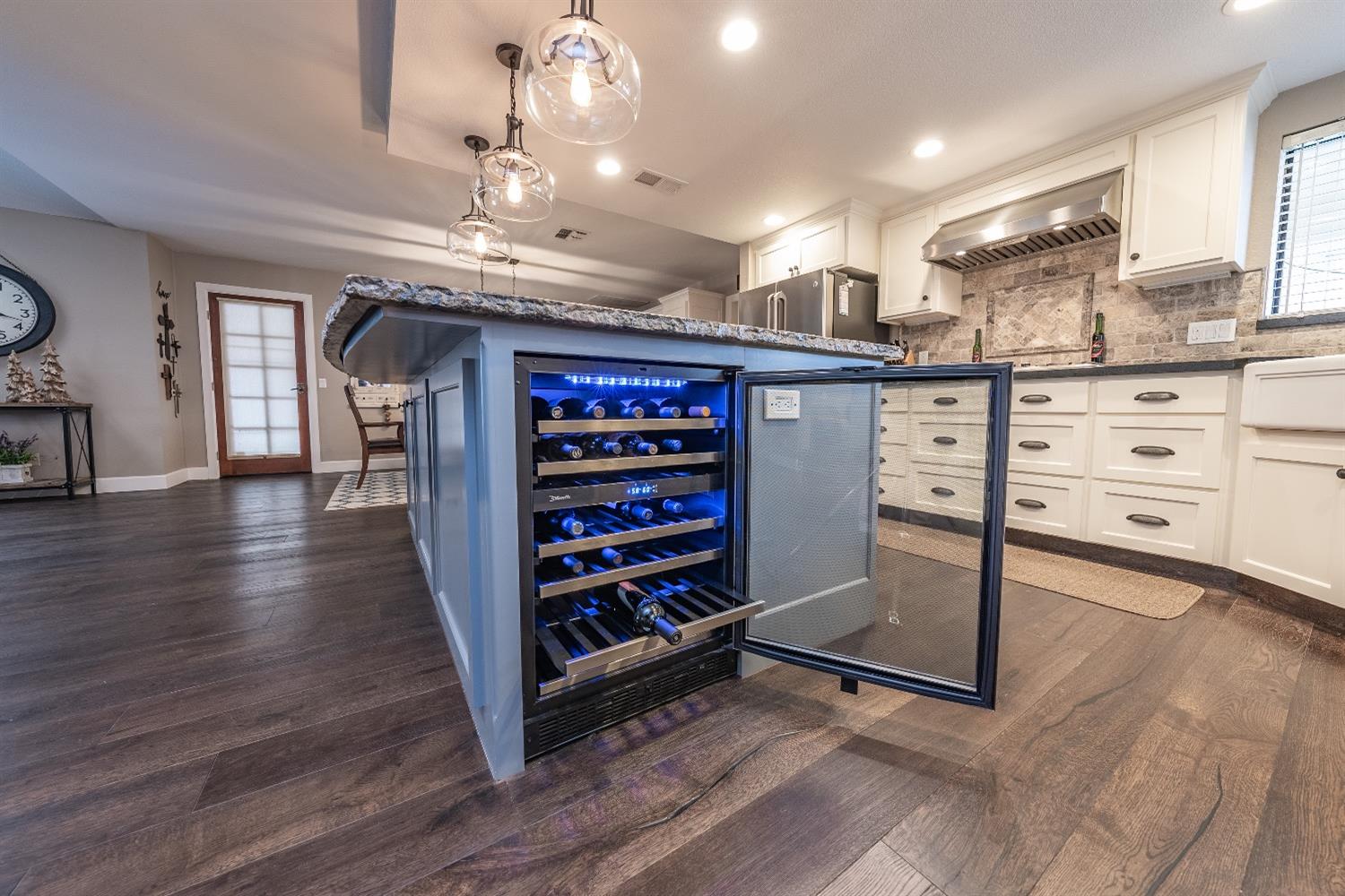 28 Seasons Court Madera, CA 93637 - Photo 14 of 47 a view of a kitchen with cabinet and refrigerator