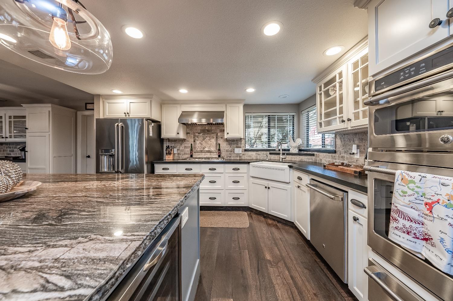28 Seasons Court Madera, CA 93637 - Photo 17 of 47 a kitchen with stainless steel appliances granite countertop lots of counter top space and cabinets