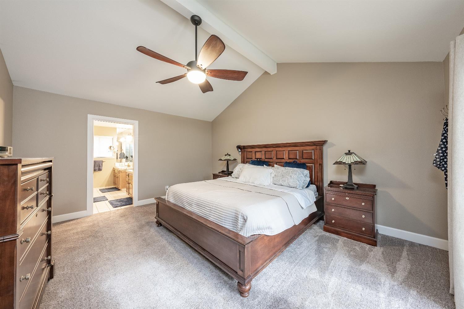 28 Seasons Court Madera, CA 93637 - Photo 18 of 47 a bedroom with a bed and a window