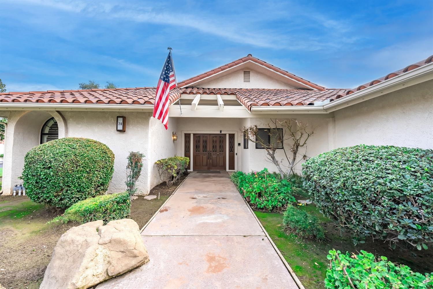 28 Seasons Court Madera, CA 93637 - Photo 2 of 47 a front view of a house with garden