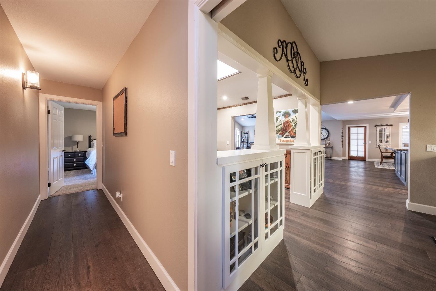 28 Seasons Court Madera, CA 93637 - Photo 24 of 47 a view of a hallway with wooden floor and staircase