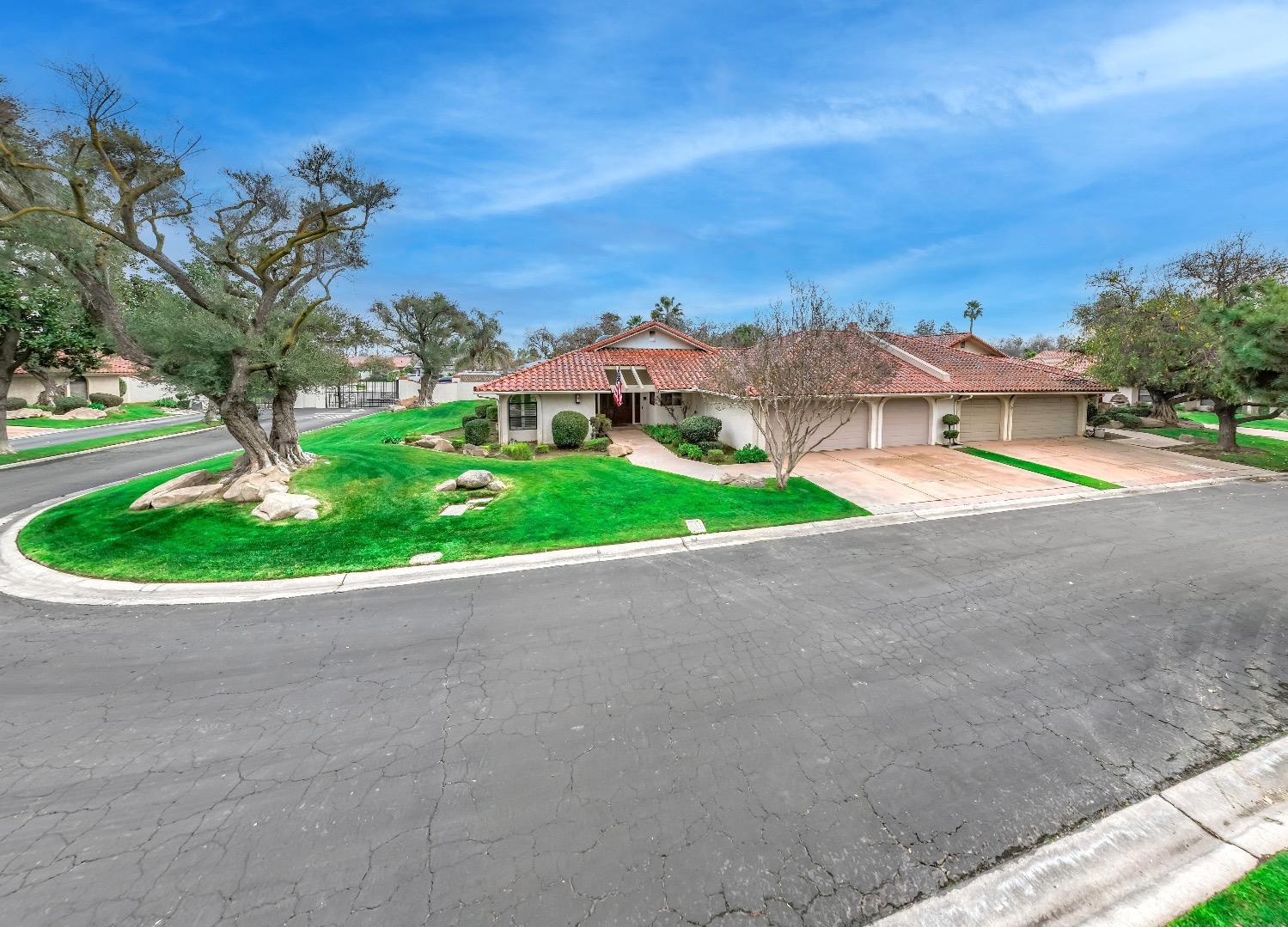 28 Seasons Court Madera, CA 93637 - Photo 33 of 47 a view of a street with a house in the background