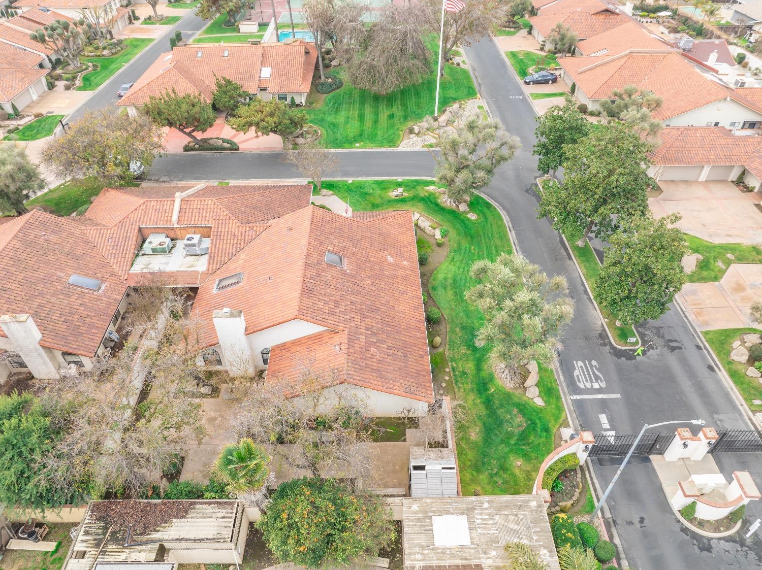 28 Seasons Court Madera, CA 93637 - Photo 44 of 47 an aerial view of a house with a yard and lake view