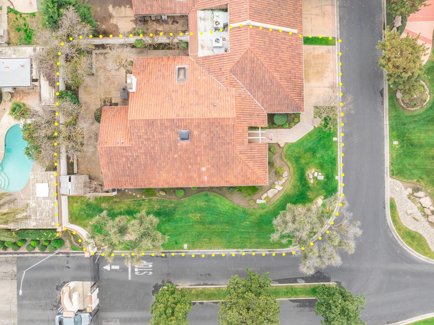 28 Seasons Court Madera, CA 93637 - Photo 45 of 47 an aerial view of a house with a yard and a fountain