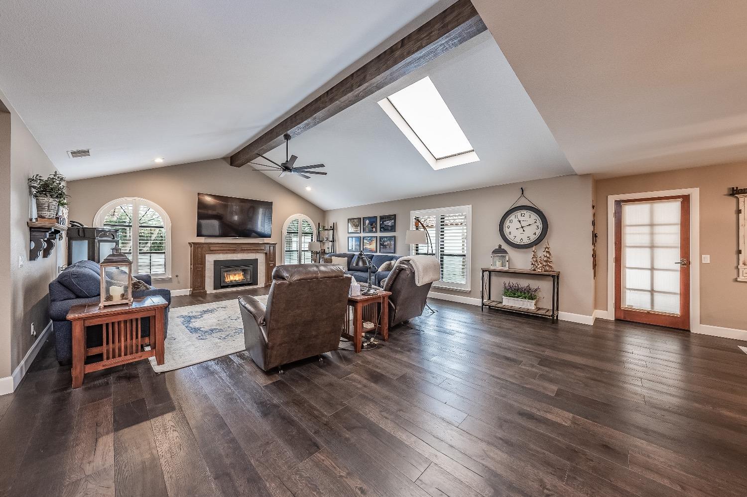 28 Seasons Court Madera, CA 93637 - Photo 6 of 47 a living room with furniture and a fireplace
