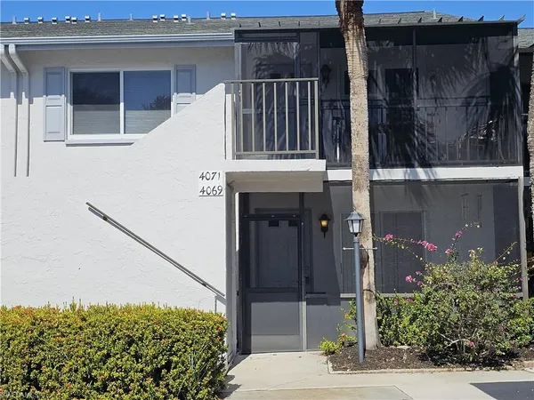 a view of balcony and yard