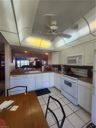a dining room with a table and chairs