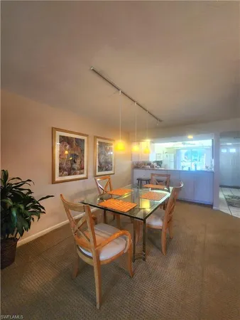 a group of cars parked in a room next to a window