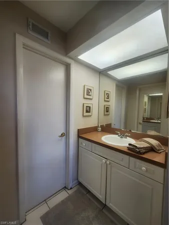 a white toilet sitting next to a bathroom sink