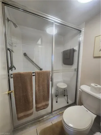 a bedroom with bed and window