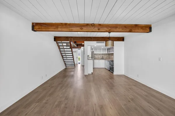 a view of a room with wooden floor and chair