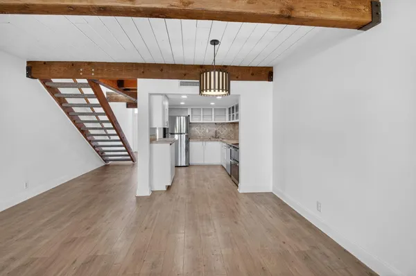 a view of a livingroom with wooden floor