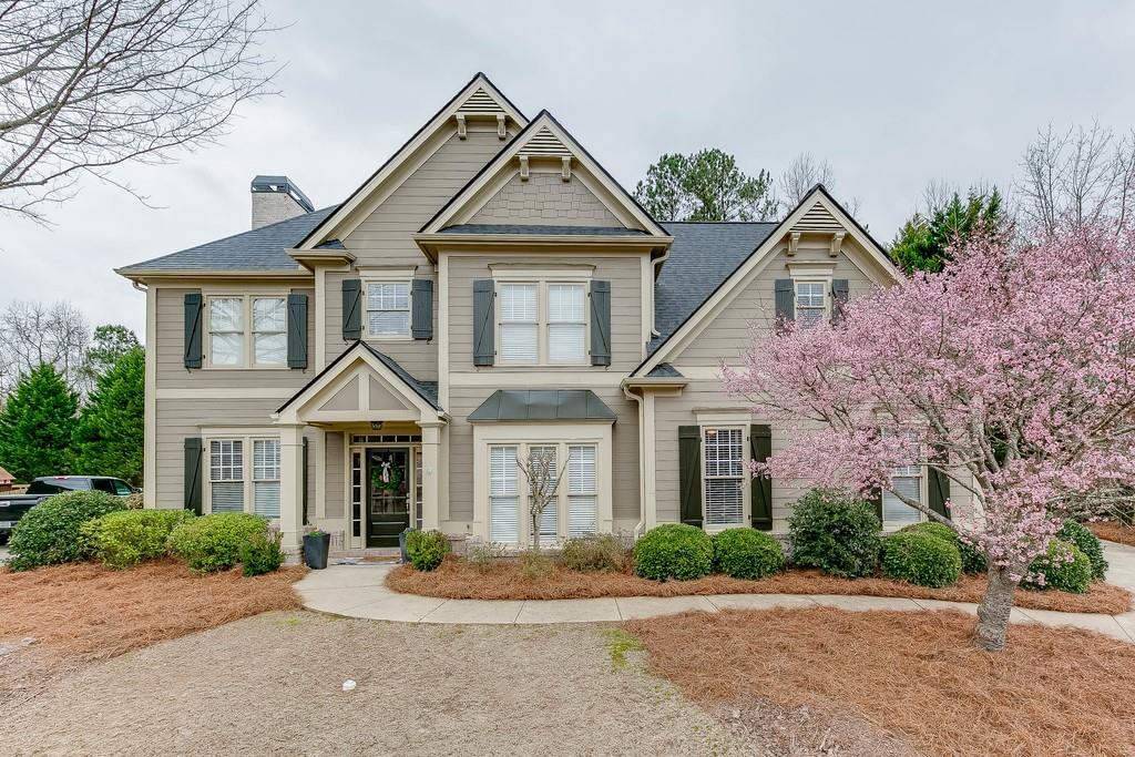 6359 Grand Loop Road Sugar Hill, GA 30518 - Photo 1 of 1 a front view of a house with a yard
