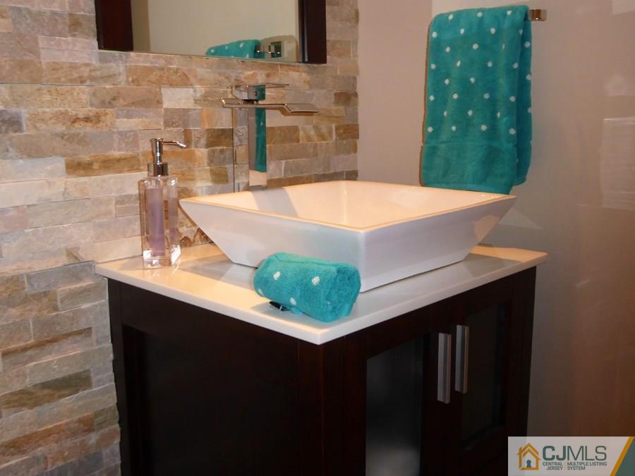 30 Smithwold Road Somerset, NJ 08873 - Photo 8 of 24 a bathroom with a sink and a mirror