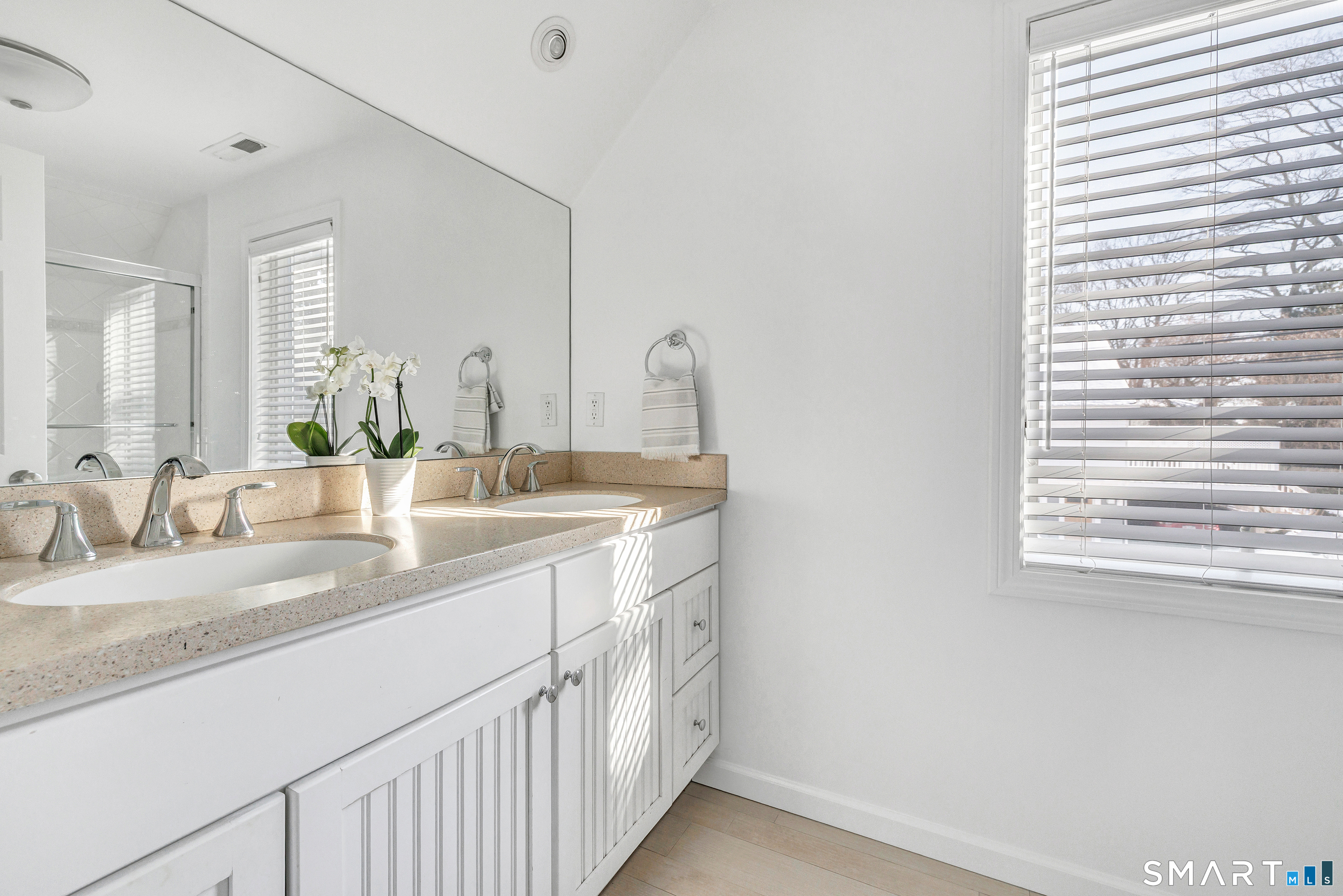 69 Grove Point Westport, CT 06880 - Photo 32 of 40 Second floor full bath with dual sinks, tub and glass-door shower.