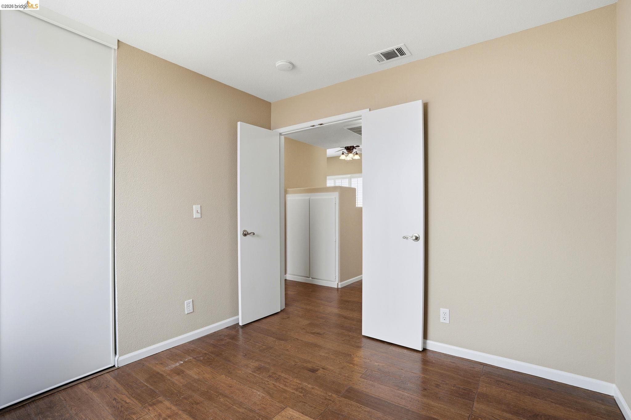 4465 Fall Lane Oakley, CA 94561 - Photo 12 of 26 a view of an empty room with wooden floor