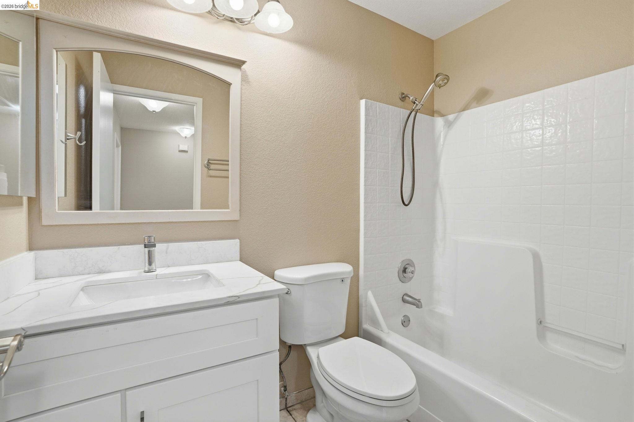 4465 Fall Lane Oakley, CA 94561 - Photo 13 of 26 a bathroom with a sink toilet and shower