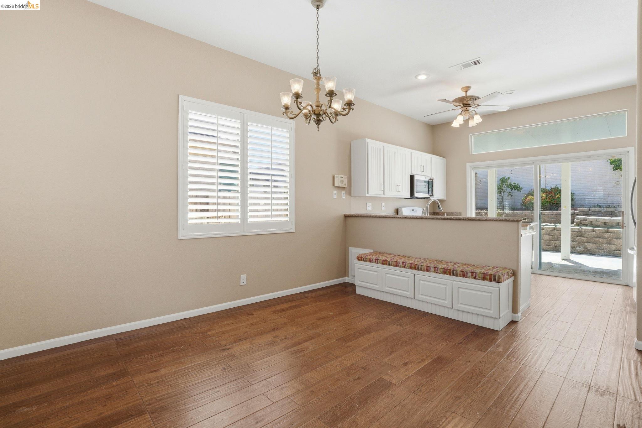 4465 Fall Lane Oakley, CA 94561 - Photo 15 of 26 a living room with stainless steel appliances granite countertop furniture and a chandelier