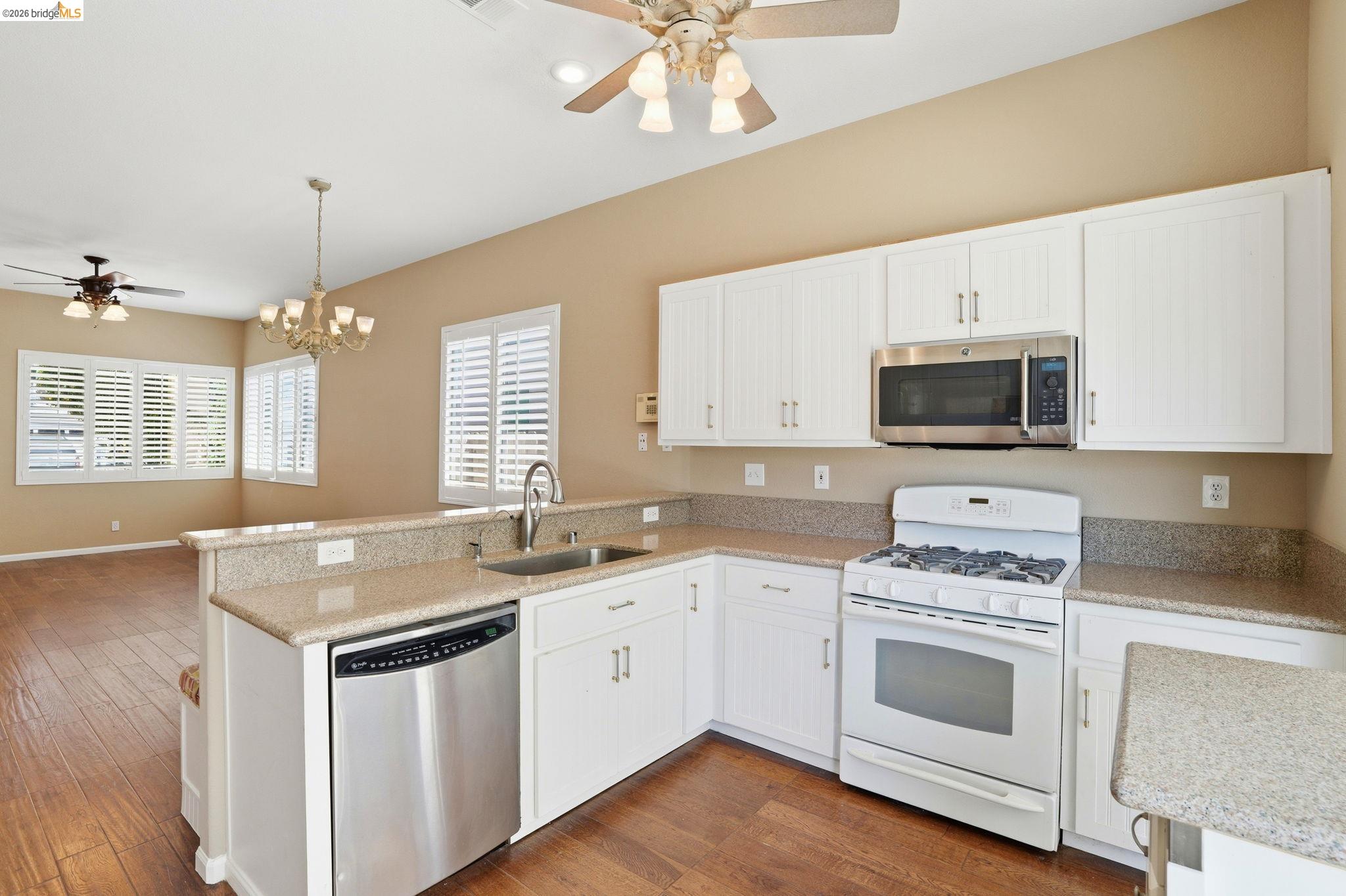 4465 Fall Lane Oakley, CA 94561 - Photo 3 of 26 a kitchen with a sink stove and microwave