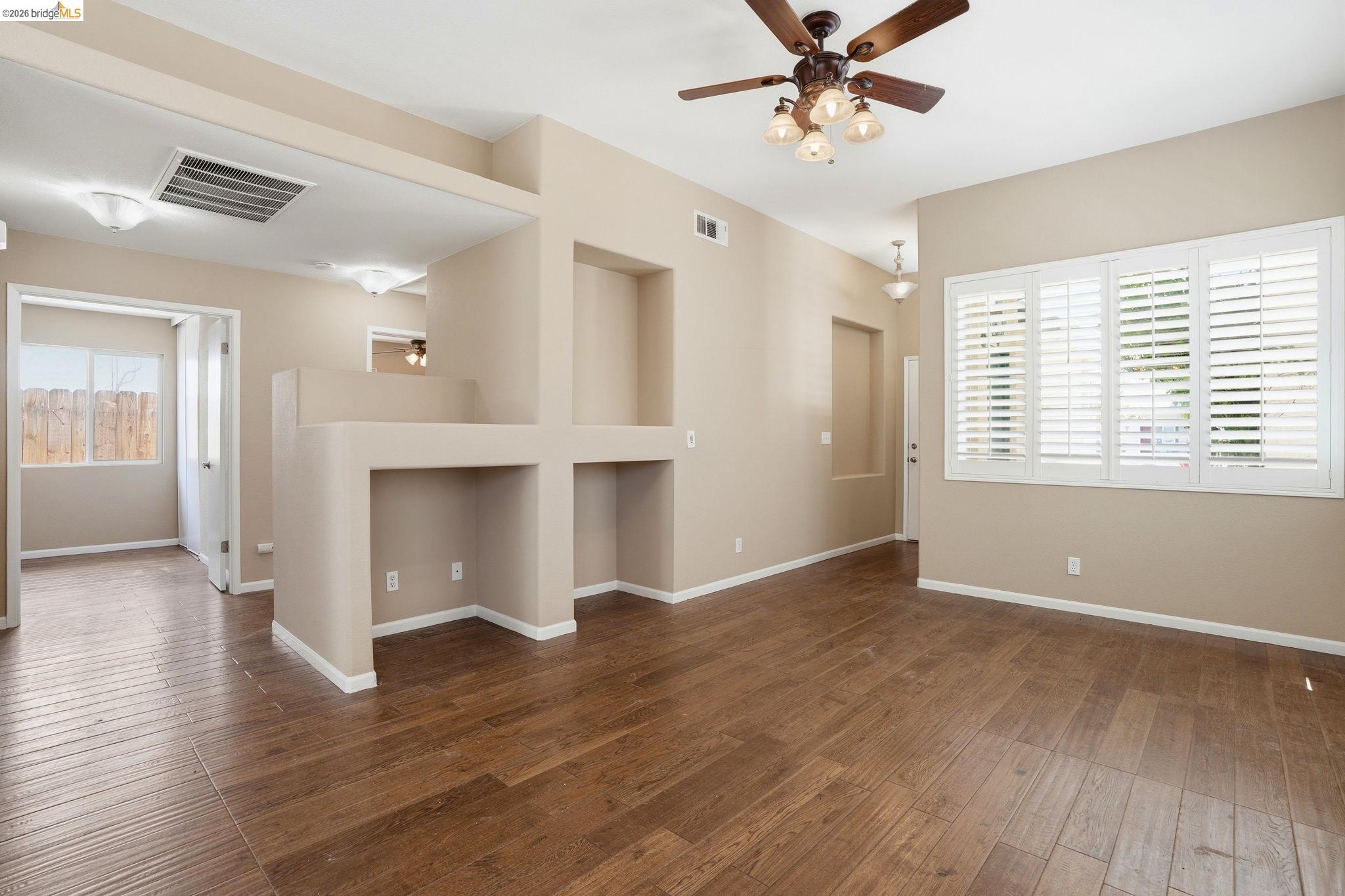 4465 Fall Lane Oakley, CA 94561 - Photo 4 of 26 a view of an empty room with a window and wooden floor