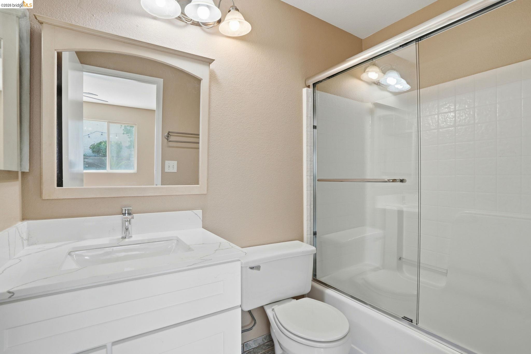 4465 Fall Lane Oakley, CA 94561 - Photo 7 of 26 a bathroom with a sink toilet vanity and shower
