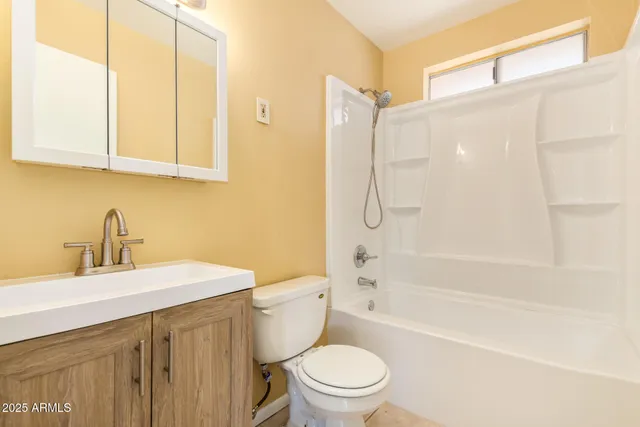 a bathroom with a sink a toilet and a bathtub