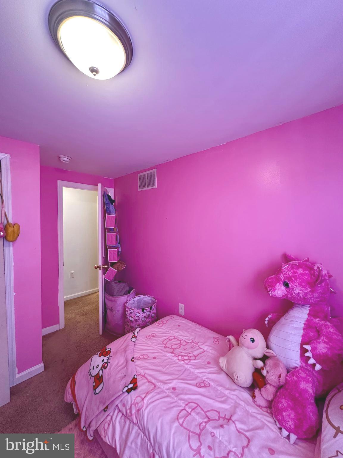 528 Randolph Street Camden, NJ 08105 - Photo 11 of 17 a bed room with a bed and a couch