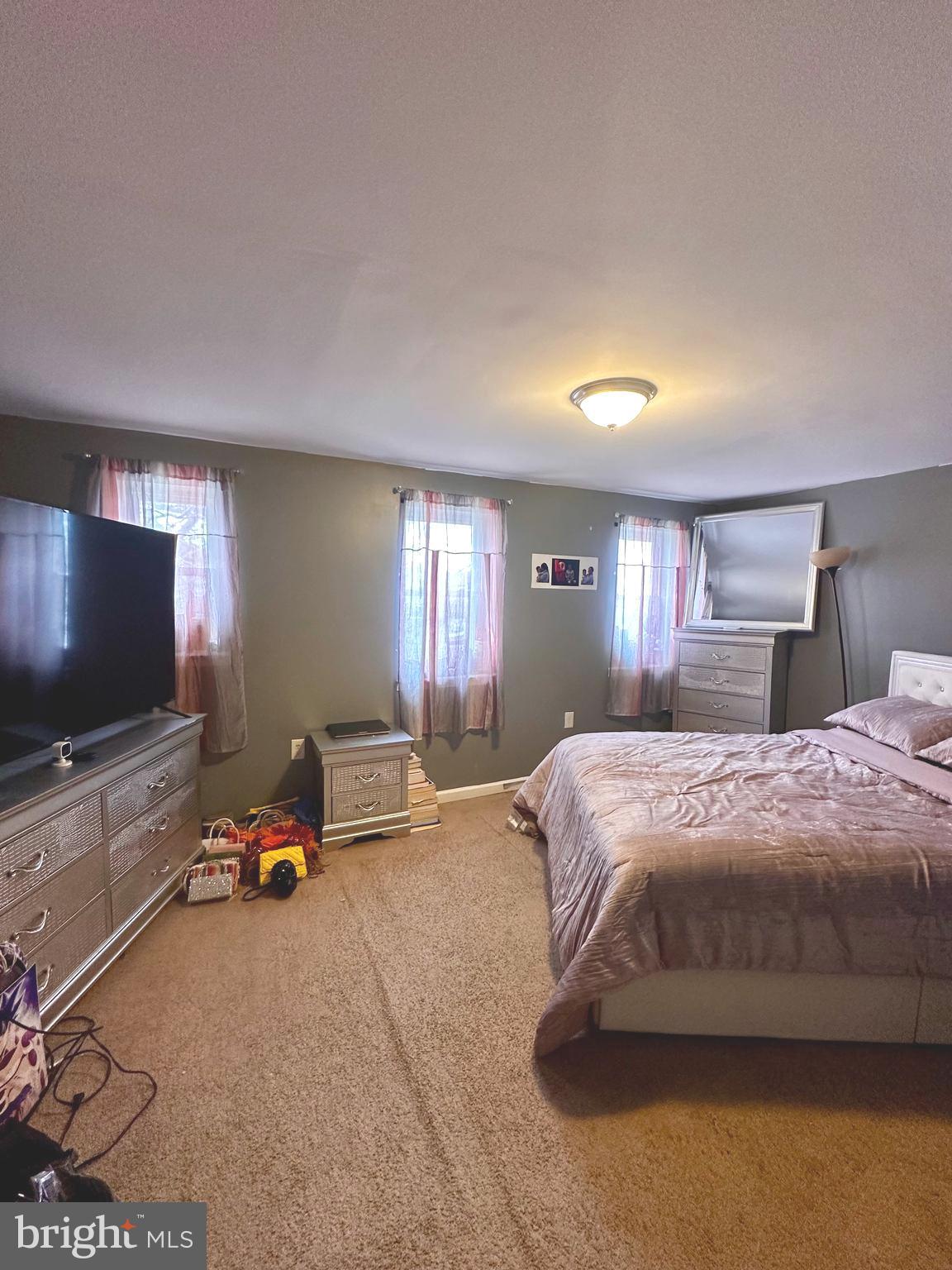 528 Randolph Street Camden, NJ 08105 - Photo 15 of 17 a bedroom with a bed and a flat screen tv