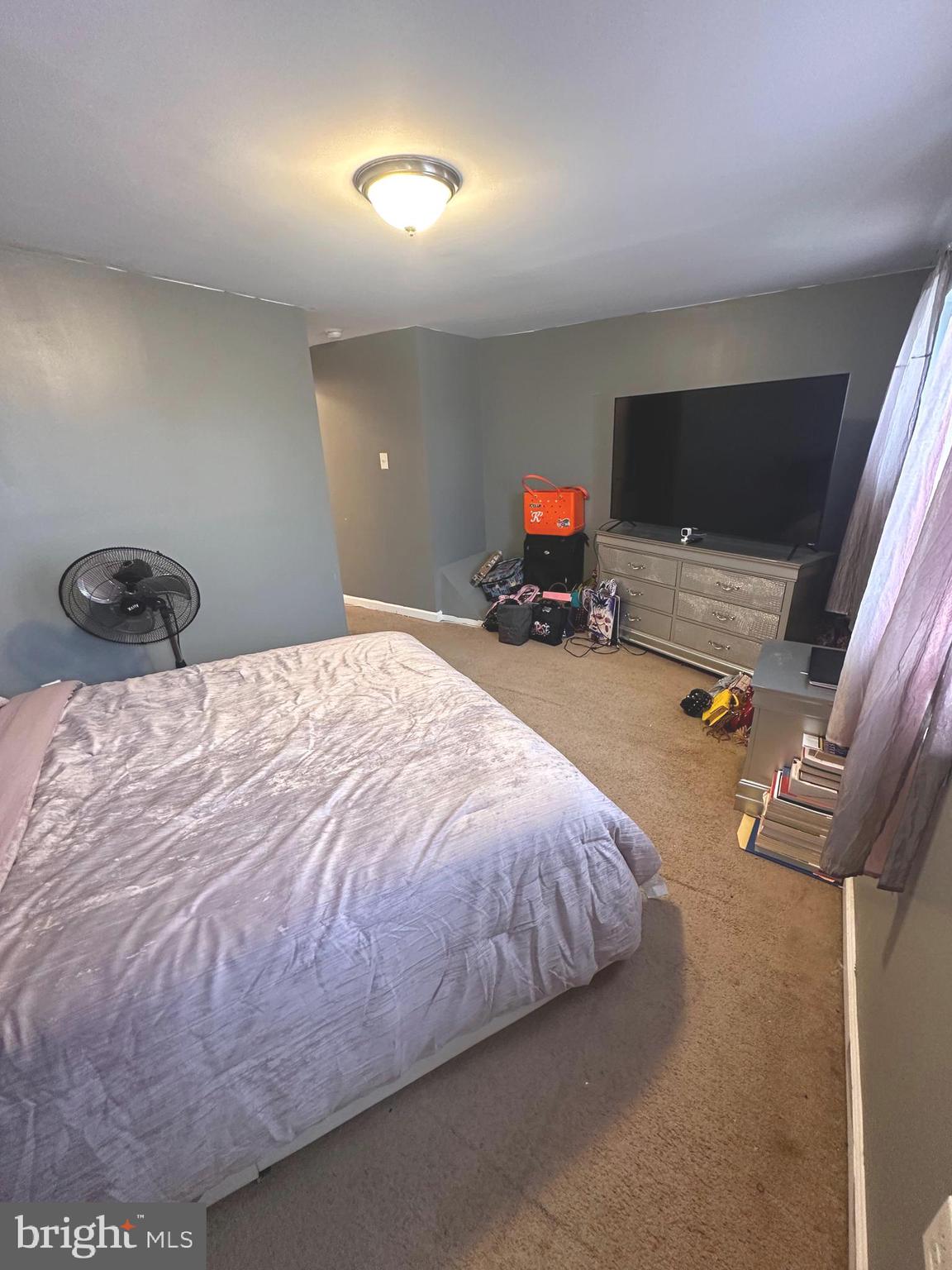 528 Randolph Street Camden, NJ 08105 - Photo 16 of 17 a bedroom with a bed and a flat screen tv