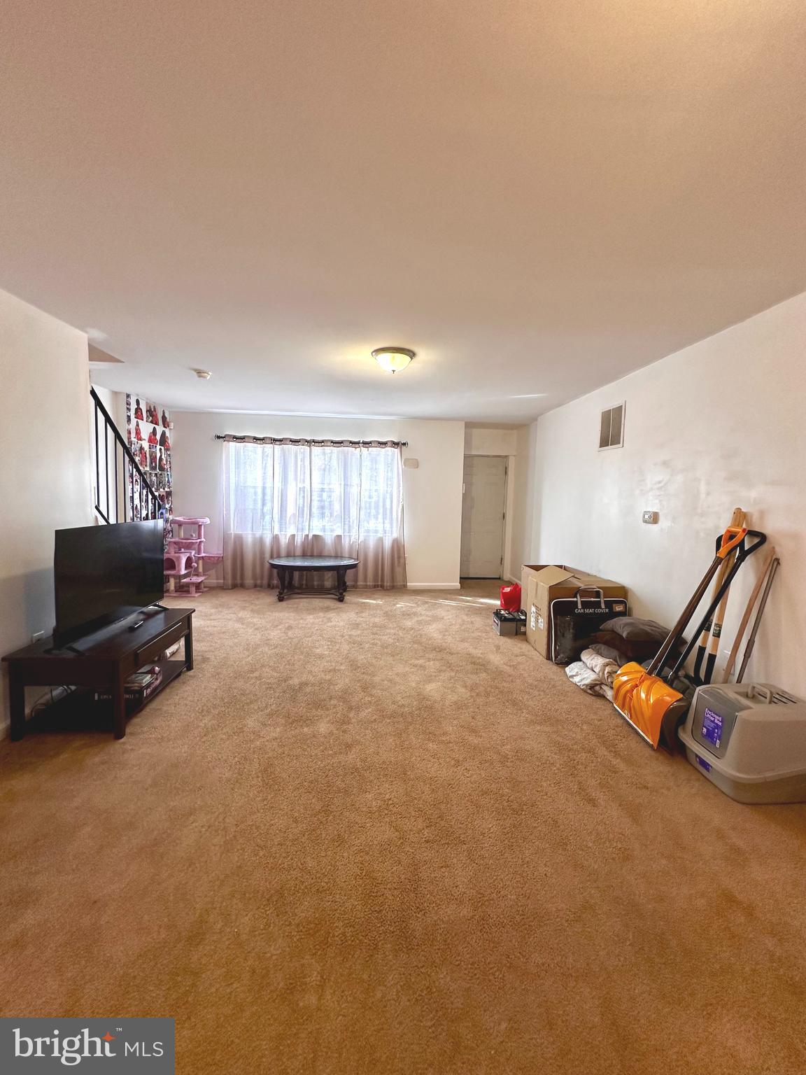 528 Randolph Street Camden, NJ 08105 - Photo 3 of 17 a room with furniture and a flat screen tv