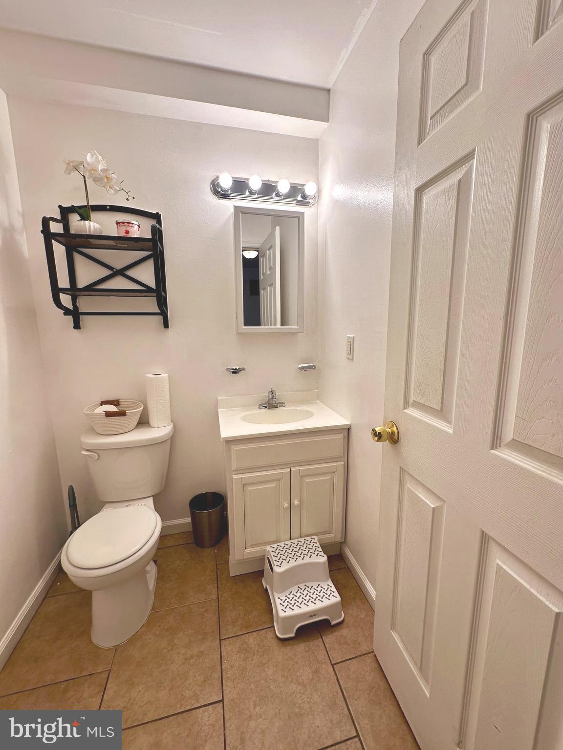 528 Randolph Street Camden, NJ 08105 - Photo 7 of 17 a bathroom with a toilet sink and mirror