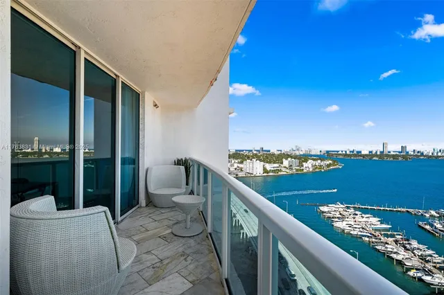 a view of balcony with furniture